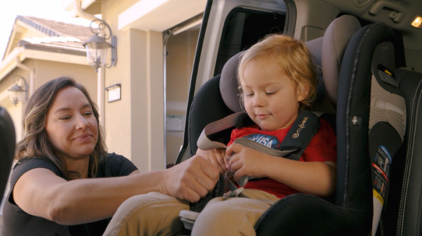 Paralympian Alana Nichols buckles in her son, Gunnar. 