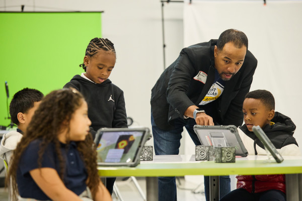 Tellis Bethel, group vice president, Social Innovation, and chief diversity officer, TMNA, with students as he served as Principal for a Day at the West Dallas STEM School.